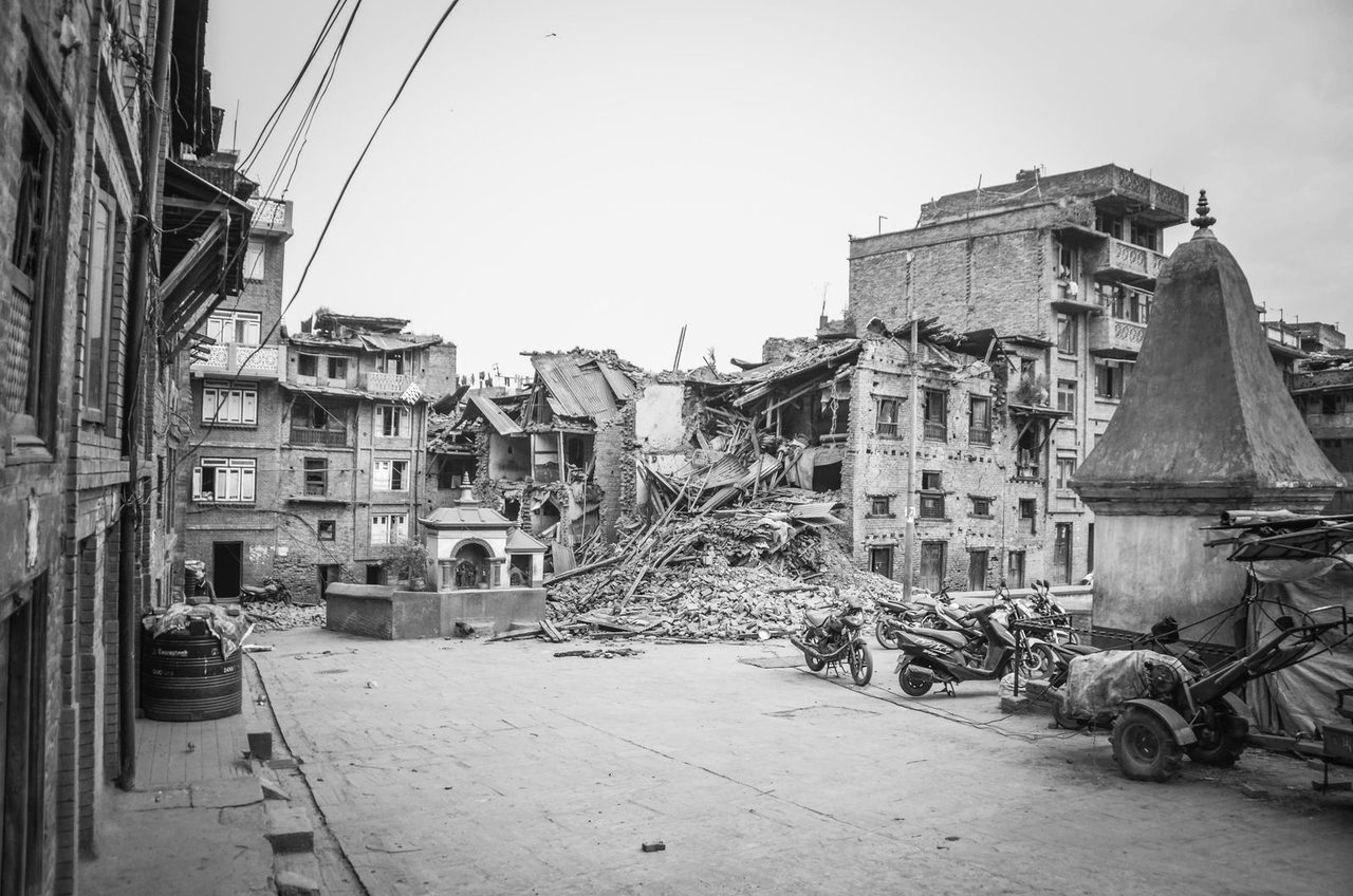 Wrecked buildings in the quake zone, photographed from a nearby street.