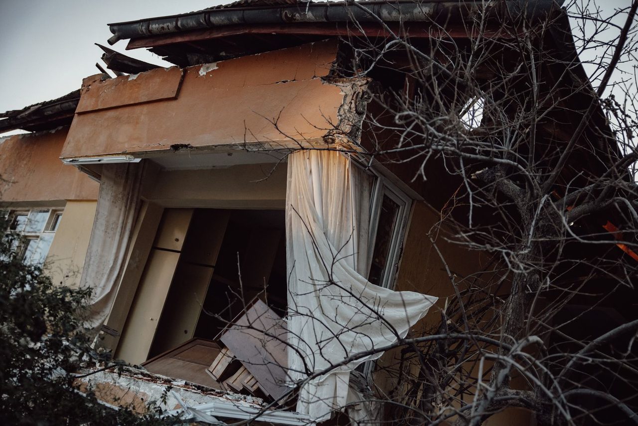 A house destroyed by the tremor — one of thousands damaged across the prefecture.