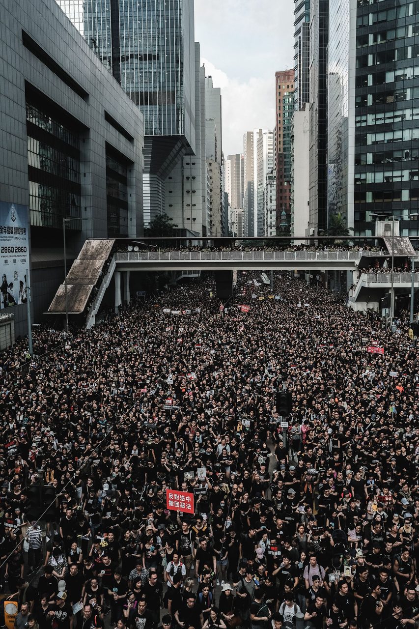 A crowd of demonstrators carries banners during a previous opposition rally.